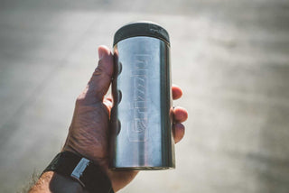 grizzly coolers drinkware, slim can koozie in palm of a hand